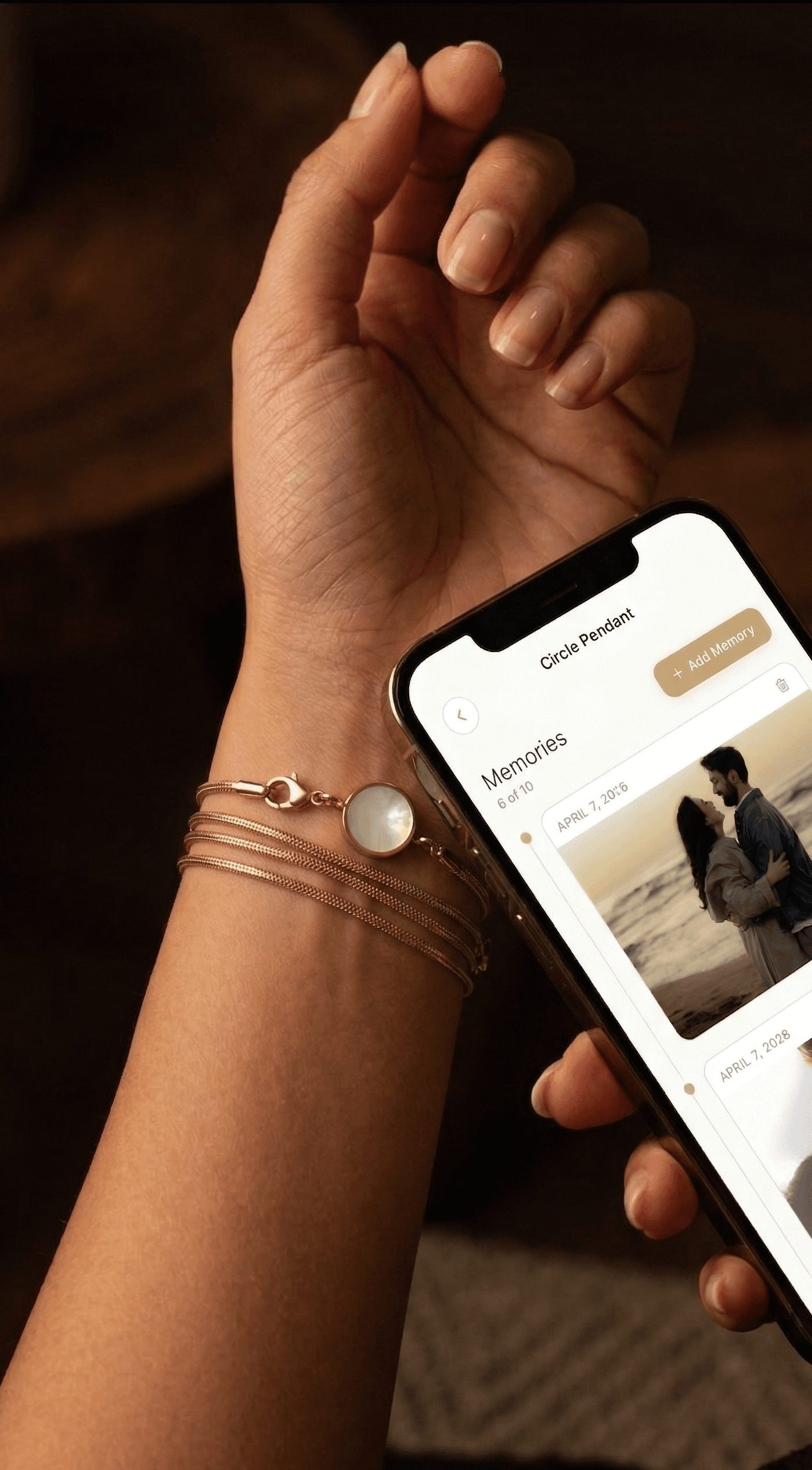 A phone displaying a Memoura memory after tapping the pendant