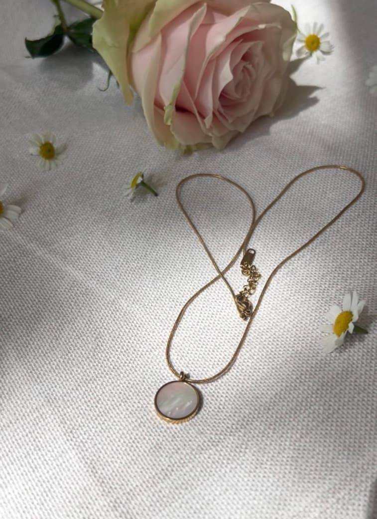 Memoura Halo necklace on linen